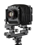 Photo of ARCA-SWISS F-Metric Field C 4x5 View Camera with quartering view, featuring base tilt, ARCA-SWISS Micro-Orbix® tilt and folding monorail. From ARCA-SWISS USA. SKU: 013545-OC