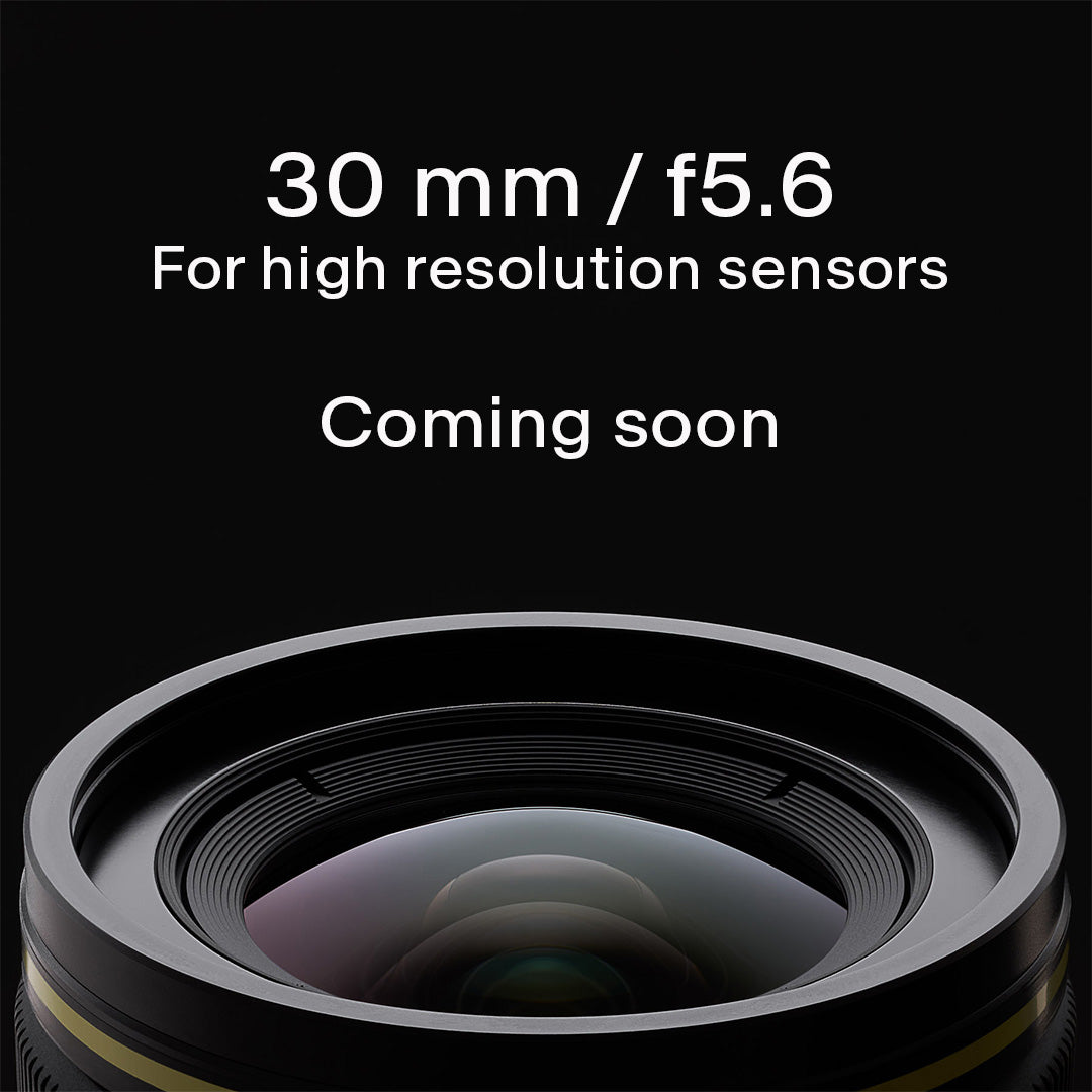 Arca 30 front element and filter ring emerging from the bottom of the frame on a black background with Coming soon intro graphics.