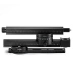 Profile view of ARCA-SWISS Pan System Pro panoramic accessory collapsed for travel, with nodal rail attached.