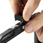 Close-up of hands installing an Arca-Swiss cold shoe to the top of an F-line camera format frame.