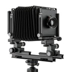 Photo of ARCA-SWISS F-Metric 4x5 View Camera with quartering view, featuring base tilt, ARCA-SWISS Micro-Orbix® tilt and folding monorail. From ARCA-SWISS USA. SKU: 013145-OC