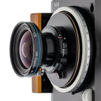 Photo of ARCA-SWISS Factum Technical Camera with quartering view, showing R-Line Lens. Featuring a compact modular and expandable system, TUM helical focusing and tilt module. From ARCA-SWISS USA. SKU: 017369