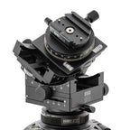 Photo of ARCA-SWISS C1 Cube cp geared tripod head with Classic quick release, showing C1 Cube cp mounted on a tripod, 3/4 front view. Featuring gear-driven, self-locking micro-metric controls. From ARCA-SWISS USA. SKU: 8501503.1